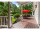Spacious porch offers an idyllic view, featuring a red umbrella for shade at 3171 Pignatelli Cres, Mount Pleasant, SC 29466