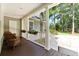 Inviting porch with comfortable seating, white columns, and hanging flower baskets, offering a relaxing outdoor space at 3171 Pignatelli Cres, Mount Pleasant, SC 29466