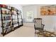 Reading nook with a window, cushions, bookshelves, artwork, and a chair at 3171 Pignatelli Cres, Mount Pleasant, SC 29466