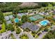 Aerial view of the community tennis and pickleball courts, featuring lush landscaping and adjacent swimming pool at 3171 Pignatelli Cres, Mount Pleasant, SC 29466