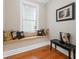 Charming window seat with decorative pillows and hardwood floors at 3171 Pignatelli Cres, Mount Pleasant, SC 29466