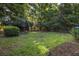 Spacious backyard with mature trees, providing privacy and shade for outdoor enjoyment at 344 Canterbury Rd, Charleston, SC 29407