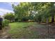 Green lawn area enclosed by trees, perfect for recreational activities or relaxing outdoors at 344 Canterbury Rd, Charleston, SC 29407