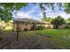 Lawn with a view of the house's brick exterior, featuring windows and a fenced area at 344 Canterbury Rd, Charleston, SC 29407