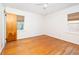 Bedroom featuring hardwood floors, neutral walls, and windows with wooden blinds at 344 Canterbury Rd, Charleston, SC 29407