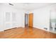 Spacious bedroom with hardwood floors, closet, and an ensuite bathroom with green tiling at 344 Canterbury Rd, Charleston, SC 29407