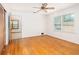 Bright bedroom with hardwood floors, a ceiling fan, and natural light from two windows at 344 Canterbury Rd, Charleston, SC 29407
