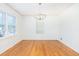 Bright dining room featuring hardwood floors, classic chandelier, and lots of windows at 344 Canterbury Rd, Charleston, SC 29407