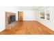 Bright living room with beautiful hardwood floors, a brick fireplace, and ample natural light at 344 Canterbury Rd, Charleston, SC 29407