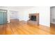 Inviting living room showcasing hardwood floors, a cozy brick fireplace, and an open layout at 344 Canterbury Rd, Charleston, SC 29407