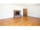 Spacious living room featuring hardwood floors and a brick fireplace at 344 Canterbury Rd, Charleston, SC 29407