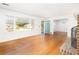 Open living area with hardwood floors, fireplace, and a view to the front door and dining area at 344 Canterbury Rd, Charleston, SC 29407
