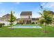 Lush backyard with screened porch, well-kept lawn, and privacy fencing at 347 Ripple Park Dr, Summerville, SC 29486