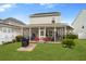 Charming home with a spacious backyard, lush lawn, and screened-in porch at 347 Ripple Park Dr, Summerville, SC 29486