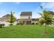 Expansive backyard with pool, manicured lawn, and relaxing screened porch at 347 Ripple Park Dr, Summerville, SC 29486