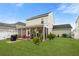 Lush backyard featuring a screened-in porch, well-manicured lawn, and outdoor seating, perfect for relaxation and entertaining at 347 Ripple Park Dr, Summerville, SC 29486