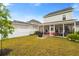 Lush backyard with screened porch, well-kept lawn, and privacy fencing at 347 Ripple Park Dr, Summerville, SC 29486