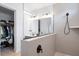 Bathroom with double vanity, a glass-enclosed shower with modern fixtures, and an adjacent walk-in closet at 347 Ripple Park Dr, Summerville, SC 29486