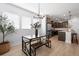 Bright dining area with modern table and chair set, hardwood floors, and natural light at 347 Ripple Park Dr, Summerville, SC 29486