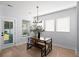 Dining area featuring a modern light fixture, table and chairs, plus plenty of natural light at 347 Ripple Park Dr, Summerville, SC 29486