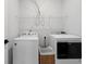 Well-organized laundry room with modern washer and dryer units, complemented by ample shelving and storage options at 347 Ripple Park Dr, Summerville, SC 29486