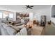 Open-concept living room seamlessly connecting to the kitchen with a sectional sofa and modern decor at 347 Ripple Park Dr, Summerville, SC 29486