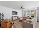 Comfortable living room featuring a large sectional sofa, neutral decor, and lots of natural light at 347 Ripple Park Dr, Summerville, SC 29486