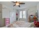Bright bedroom with a ceiling fan, mushroom decor, closet, sewing machine, and bed with decorative bedding at 357 Beachgrass Ln, Summerville, SC 29486