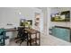 Bright bedroom features a neutral decor, a workstation with dual monitors and a wall mounted television at 357 Beachgrass Ln, Summerville, SC 29486