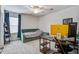 Bright bedroom featuring a daybed, a ceiling fan and a workstation with a modern monitor and neutral carpet at 357 Beachgrass Ln, Summerville, SC 29486