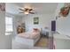 Bright bedroom with neutral walls, ceiling fan, decoratively made bed, and an assortment of furniture at 357 Beachgrass Ln, Summerville, SC 29486