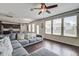 Open concept living space with wood floors, a ceiling fan, and many windows for natural light at 357 Beachgrass Ln, Summerville, SC 29486