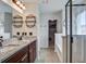 Modern bathroom with double vanity, walk-in closet access, and sleek finishes at 357 Beachgrass Ln, Summerville, SC 29486