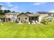 Expansive backyard featuring a patio, fire pit, swing set, and ample green space at 3789 Tupelo Branch Row, Mount Pleasant, SC 29429