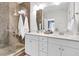 Modern bathroom featuring double sinks, granite countertops, glass enclosed shower, and white cabinets at 3789 Tupelo Branch Row, Mount Pleasant, SC 29429