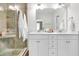 Elegant bathroom boasts a double vanity, granite countertops, glass enclosed shower, and tile floor at 3789 Tupelo Branch Row, Mount Pleasant, SC 29429