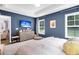 Serene bedroom with a soothing color palette, large windows, and stylish furnishings at 3789 Tupelo Branch Row, Mount Pleasant, SC 29429