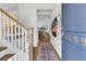 Inviting entryway with wood floors and stairs leads to a stylish home interior at 3789 Tupelo Branch Row, Mount Pleasant, SC 29429