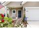 Inviting front entrance featuring a rocking bench, hanging plants, and an American flag at 3789 Tupelo Branch Row, Mount Pleasant, SC 29429