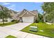 Well-maintained home featuring a spacious driveway, lush lawn, and attractive curb appeal in a quiet neighborhood at 3789 Tupelo Branch Row, Mount Pleasant, SC 29429