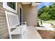 Inviting front porch with a white bench, a view of the front door, and a partial view of the street at 3789 Tupelo Branch Row, Mount Pleasant, SC 29429
