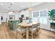 Bright eat-in kitchen with white cabinets, stainless appliances, and a stylish breakfast nook at 3789 Tupelo Branch Row, Mount Pleasant, SC 29429