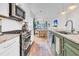 Modern kitchen with a view of the dining and living area, and stainless steel appliances at 3789 Tupelo Branch Row, Mount Pleasant, SC 29429