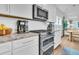 Well-equipped kitchen with stainless steel appliances and ample counter space, ready for culinary adventures at 3789 Tupelo Branch Row, Mount Pleasant, SC 29429