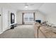 Inviting living room featuring comfortable seating, carpeted floors, a window, and neutral decor at 3789 Tupelo Branch Row, Mount Pleasant, SC 29429