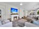 Comfortable living room with fireplace and large sectional sofa, ideal for relaxation at 3789 Tupelo Branch Row, Mount Pleasant, SC 29429