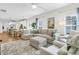 Bright and spacious living room open to kitchen and dining area, with comfortable seating and natural light at 3789 Tupelo Branch Row, Mount Pleasant, SC 29429