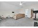 Large living room features comfortable seating, neutral decor, a ceiling fan, and carpeted floors at 3789 Tupelo Branch Row, Mount Pleasant, SC 29429