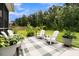 Charming patio with stylish decor, outdoor seating and lush greenery for relaxing and entertaining at 3789 Tupelo Branch Row, Mount Pleasant, SC 29429