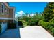 Side view of the property showing the backyard, landscaping, and waterway at 391 Evian Way, Mount Pleasant, SC 29464
